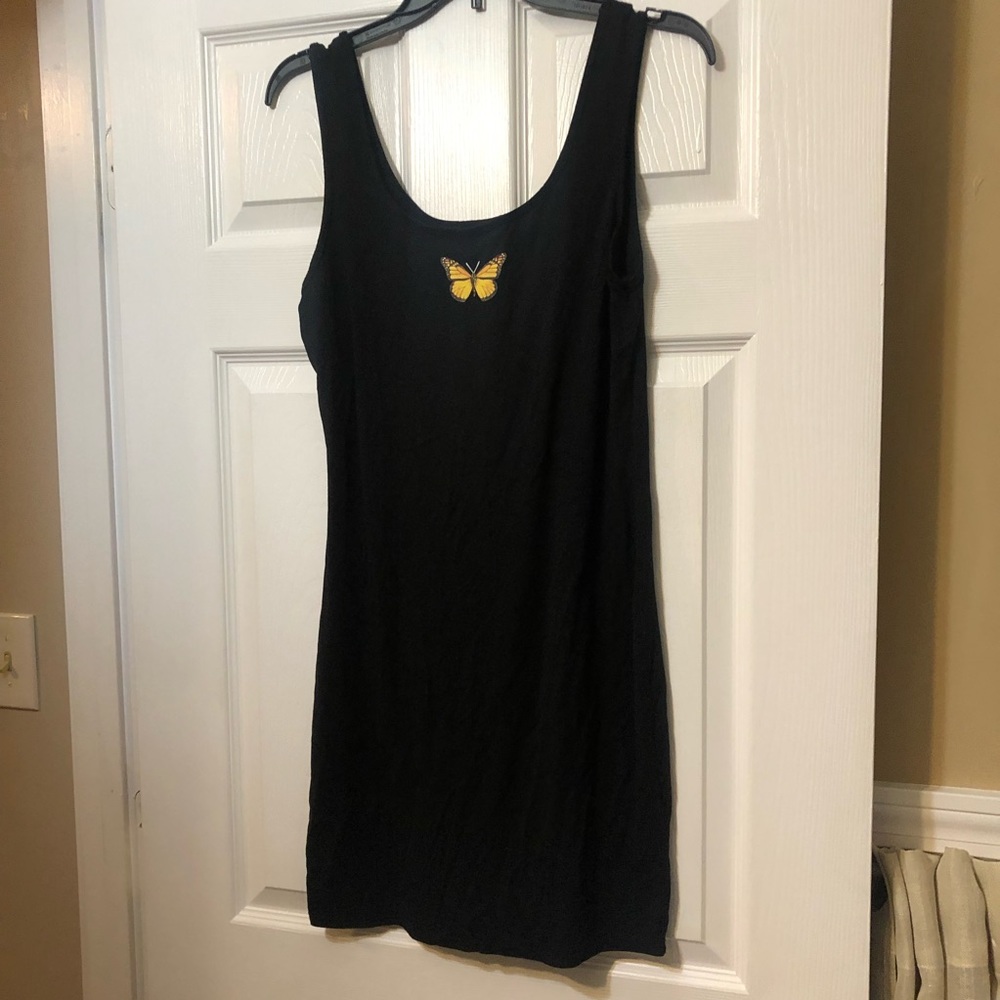 Black fitted dress with butterfly decal.